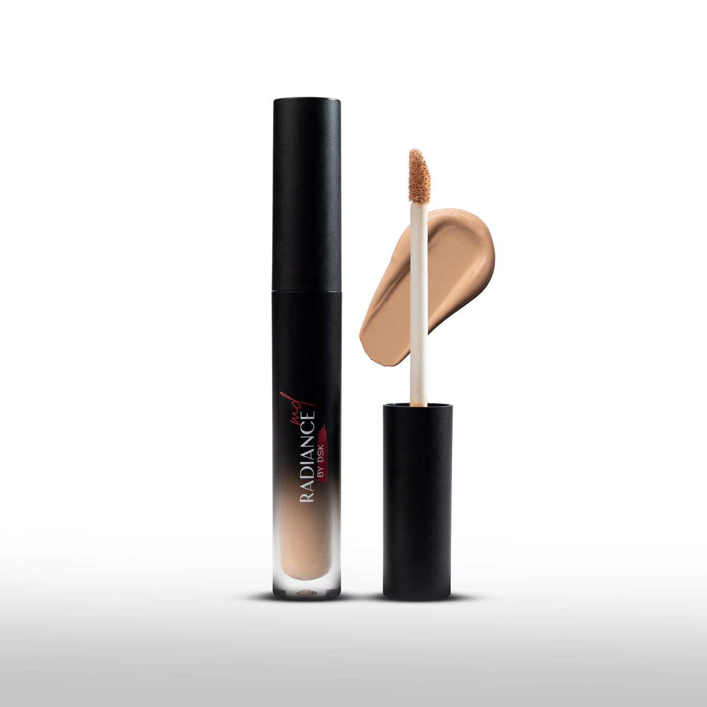 Concealer with applicator and packaging on a white background