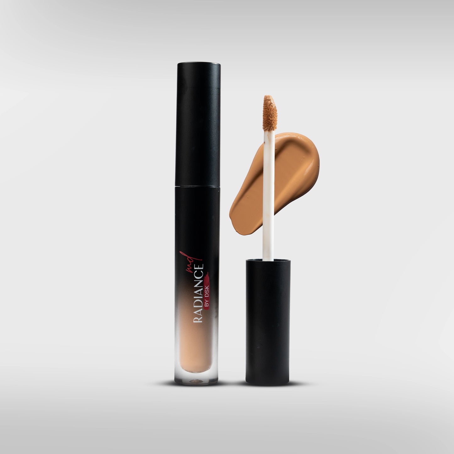 Concealer bottle with applicator and swatch on a light gray background